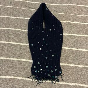 This is a cashmere scarf wraps around the neck super cute detailing